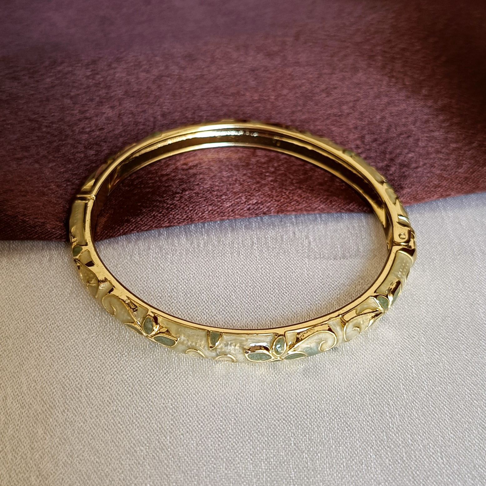 JJ Gold-Plated Ivory Enamel Bangle Leaf Motif Design