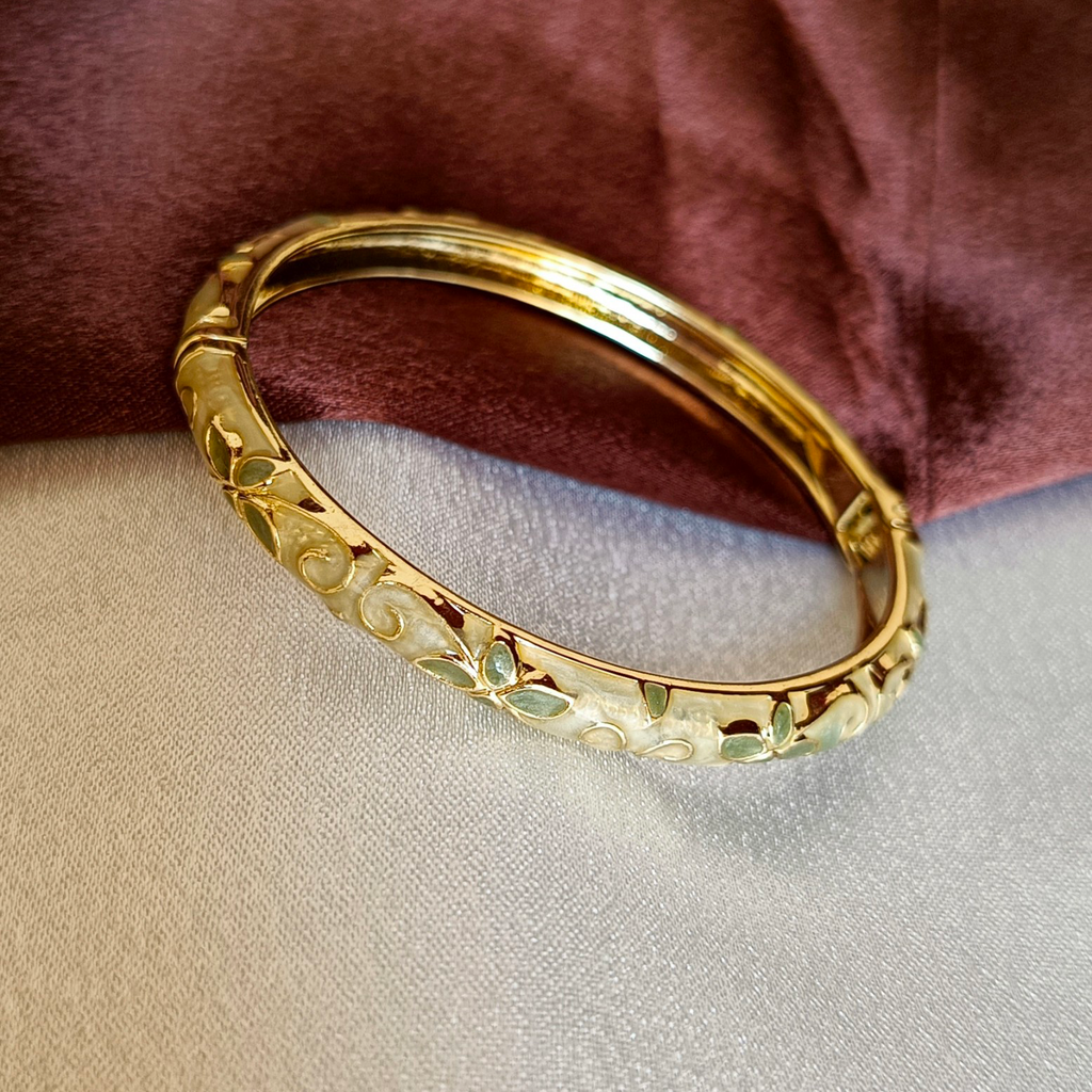 JJ Gold-Plated Ivory Enamel Bangle Leaf Motif Design