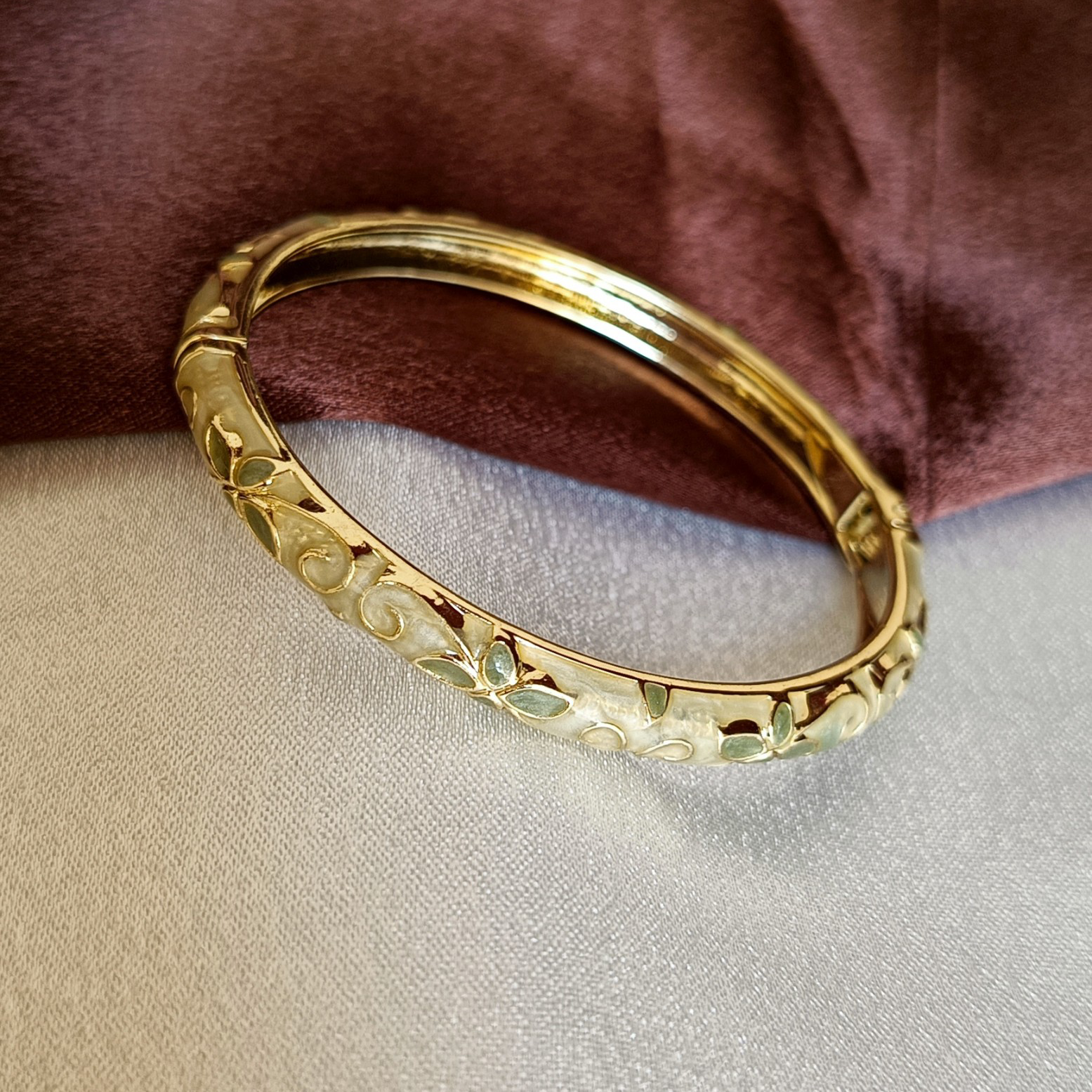 JJ Gold-Plated Ivory Enamel Bangle Leaf Motif Design
