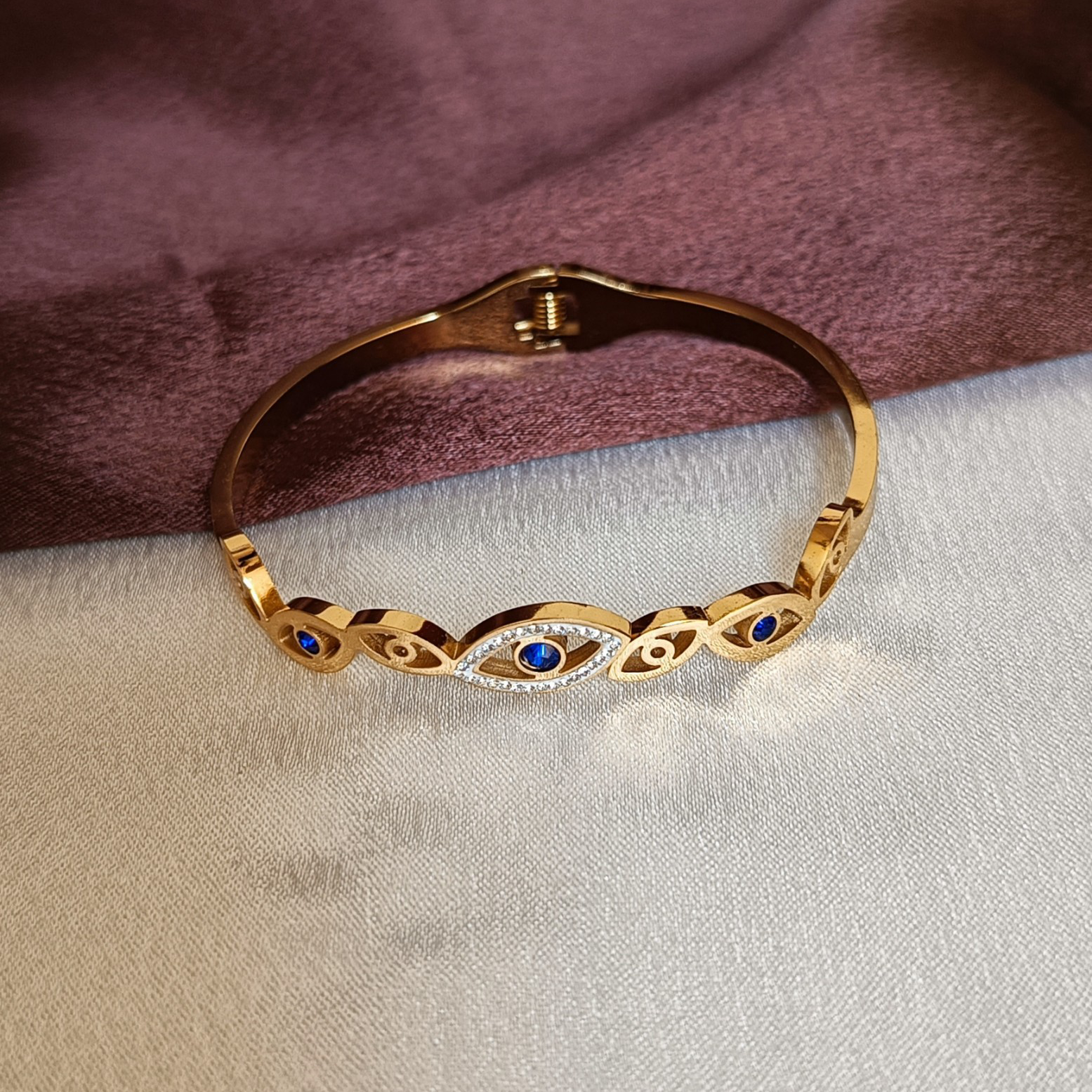 JJ Gold-Plated Evil Eye Cuff Sapphire Accent Design