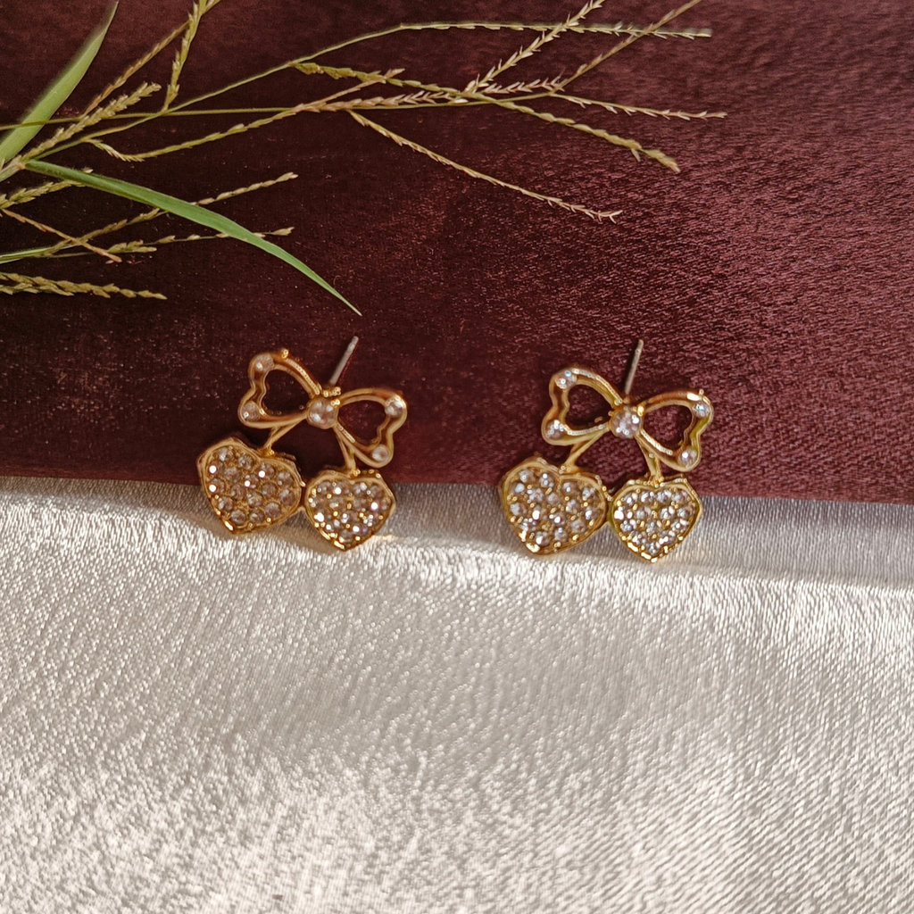 JJ Gold Heart Stud Earrings – Sparkling Bow & Heart Design