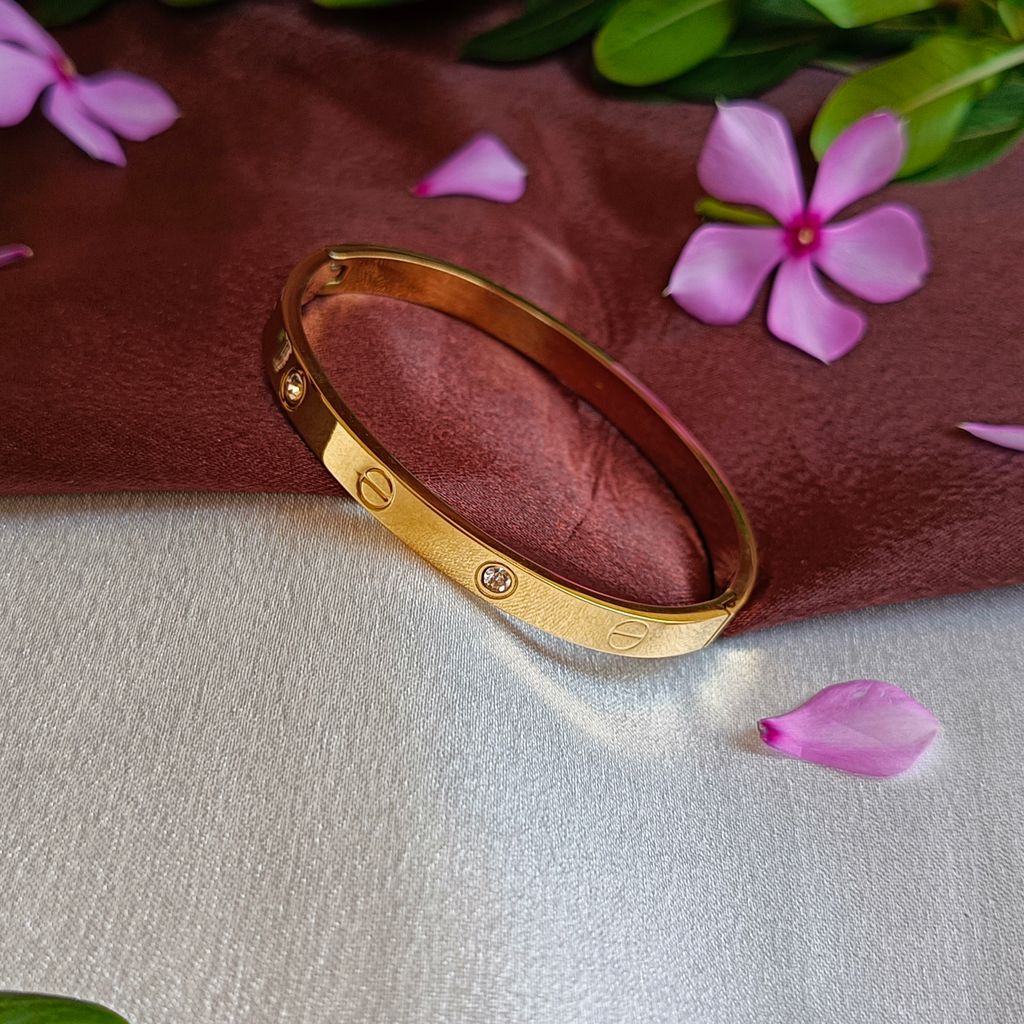 JJ Gold-Plated Screw Motif Bangle Crystal Accent Design